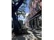 Charming street view with brick buildings and mature trees, showcasing a historic neighborhood at 160 Comanche Dr., Georgetown, SC 29440