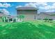 View of the home's backyard featuring lush green grass and privacy fence at 161 Barclay Dr., Myrtle Beach, SC 29579