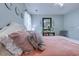 Comfortable bedroom featuring a ceiling fan, stylish furniture, and decorative mirrors at 161 Barclay Dr., Myrtle Beach, SC 29579