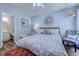 Comfortable bedroom featuring wood floors, ceiling fan, and adjacent bathroom at 161 Barclay Dr., Myrtle Beach, SC 29579