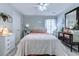 Comfortable bedroom featuring a ceiling fan, stylish furniture, and natural lighting at 161 Barclay Dr., Myrtle Beach, SC 29579