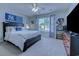 Bright bedroom with a ceiling fan, large window, and bed with built-in storage at 161 Barclay Dr., Myrtle Beach, SC 29579