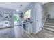 The bright entryway welcomes you in with an open door view, modern shelving, and easy access to the stairs at 161 Barclay Dr., Myrtle Beach, SC 29579