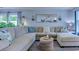 This living room features a large sectional sofa, decorative pillows, ottoman, and neutral color palette at 161 Barclay Dr., Myrtle Beach, SC 29579