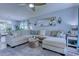 Bright living room features a comfortable sectional sofa, stylish rug, ceiling fan, and modern decor at 161 Barclay Dr., Myrtle Beach, SC 29579