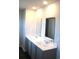 Modern bathroom with double sink vanity, large mirrors, and granite countertops at 161 Londonshire Dr., Myrtle Beach, SC 29579