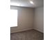 This cozy bedroom features neutral walls, plush carpeting, and a bright window at 161 Londonshire Dr., Myrtle Beach, SC 29579