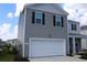 Two-story home with gray siding, a two-car garage, and a manicured front lawn at 161 Londonshire Dr., Myrtle Beach, SC 29579