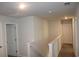 Hallway with carpeted floors, white walls, base trim, and several white doors at 161 Londonshire Dr., Myrtle Beach, SC 29579