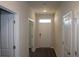 Hallway with neutral walls, white doors, and wood-look flooring at 161 Londonshire Dr., Myrtle Beach, SC 29579