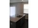 Kitchen island with granite countertop, stainless steel sink, and gray cabinets at 161 Londonshire Dr., Myrtle Beach, SC 29579