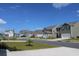Street view of a neighborhood with well-maintained homes, manicured lawns, and paved roads at 161 Londonshire Dr., Myrtle Beach, SC 29579