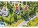 An aerial view displaying the property layout with a well-manicured lawn and mature trees at 1619 Deer Park Ln., Surfside Beach, SC 29575