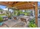 Covered outdoor living area with bench swings at 1619 Deer Park Ln., Surfside Beach, SC 29575