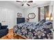 A bedroom with hardwood floors, a comfortable bed, and natural lighting creating a cozy atmosphere at 1619 Deer Park Ln., Surfside Beach, SC 29575