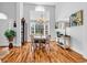 Dining room with hardwood floors, lots of light, and views of the foyer and front door at 1619 Deer Park Ln., Surfside Beach, SC 29575