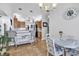 Bright eat-in kitchen featuring tile flooring, pendant lighting, wooden cabinetry, and a breakfast bar at 1619 Deer Park Ln., Surfside Beach, SC 29575