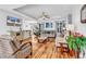 Bright living room featuring hardwood floors, comfortable seating, and a ceiling fan at 1619 Deer Park Ln., Surfside Beach, SC 29575