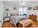 Charming bedroom featuring hardwood floors, ample natural light, and comfortable seating area at 1619 Deer Park Ln., Surfside Beach, SC 29575