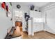 A stylish mudroom with white cabinets, shelving, tiled flooring, and access to the backyard at 1619 Deer Park Ln., Surfside Beach, SC 29575