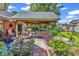 Covered patio with ample seating, ideal for entertaining and enjoying the landscaped backyard at 1619 Deer Park Ln., Surfside Beach, SC 29575