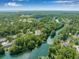 Stunning aerial shot of townhomes located in an area with waterway access and gorgeous mature trees at 178 Beaver Pond Loop # 60, Pawleys Island, SC 29585