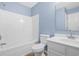 Bright bathroom with tub and shower combination, updated vanity, modern fixtures, and neutral-toned walls at 178 Beaver Pond Loop # 60, Pawleys Island, SC 29585