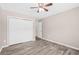 Bedroom featuring neutral paint, wood-look floors, ceiling fan, and closet at 178 Beaver Pond Loop # 60, Pawleys Island, SC 29585