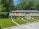 Well-maintained townhomes with lush green lawn at 178 Beaver Pond Loop # 60, Pawleys Island, SC 29585