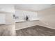 Modern kitchen features white cabinets, updated appliances, and a breakfast bar overlooking the adjacent dining area at 178 Beaver Pond Loop # 60, Pawleys Island, SC 29585