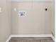 Neutral Laundry Room with washer/dryer hookups and wire rack shelving at 178 Beaver Pond Loop # 60, Pawleys Island, SC 29585