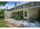 Exterior patio with greenery and access to the home at 178 Beaver Pond Loop # 60, Pawleys Island, SC 29585
