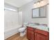 Bathroom featuring tub, toilet, vanity with marble countertop, sink, and wood-look floors at 219 Blackpepper Loop, Little River, SC 29566