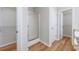 Bathroom featuring glass door shower, vinyl floors, and walk-in closet at 219 Blackpepper Loop, Little River, SC 29566