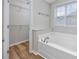 Bathroom with large tub, vinyl floor, and closet at 219 Blackpepper Loop, Little River, SC 29566