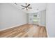 Bright bedroom featuring a bay window, neutral walls, ceiling fan and wood-look floors at 219 Blackpepper Loop, Little River, SC 29566