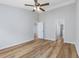 Large bedroom with ceiling fan, wood-look floors and multiple doorways to other rooms at 219 Blackpepper Loop, Little River, SC 29566