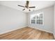Sunlit bedroom with wood-look flooring and bright window at 219 Blackpepper Loop, Little River, SC 29566