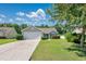 Charming single-story home with a well-manicured lawn and attached two-car garage at 219 Blackpepper Loop, Little River, SC 29566