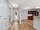 Inviting foyer with glass front door and views of the kitchen with stainless steel appliances at 219 Blackpepper Loop, Little River, SC 29566