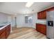 Bright, open kitchen and dining area featuring stainless steel appliances and wood cabinets at 219 Blackpepper Loop, Little River, SC 29566