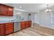 Kitchen area featuring granite countertops, wood cabinets, and stainless steel appliances at 219 Blackpepper Loop, Little River, SC 29566