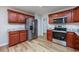 Stylish kitchen with stainless steel appliances, wood cabinetry and a view of the pantry at 219 Blackpepper Loop, Little River, SC 29566