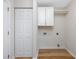 The laundry room features a bi-fold closet, upper cabinets, and utility connections at 219 Blackpepper Loop, Little River, SC 29566