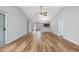Spacious open-concept living area featuring wood floors, high ceilings, and seamless transition to the kitchen at 219 Blackpepper Loop, Little River, SC 29566