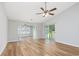 Spacious living room featuring wood floors, an open layout, and large windows at 219 Blackpepper Loop, Little River, SC 29566