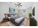 Staged bedroom with vaulted ceilings, bay windows, ceiling fan and ensuite bathroom at 219 Blackpepper Loop, Little River, SC 29566