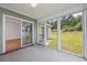 Screened porch with views of back yard, and a sliding door leading to the living room at 219 Blackpepper Loop, Little River, SC 29566