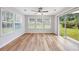 Empty sun room with lots of windows and a glass sliding door leading to the backyard at 219 Blackpepper Loop, Little River, SC 29566