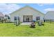 Large backyard featuring a patio, fire pit, and a grill at 227 Palm Terrace Loop, Conway, SC 29526